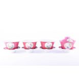 A set of three Chinese Famille rose rice bowls and stands, 20th century, each with roundels of