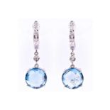 A pair of 18ct white gold, diamond, and topaz drop earringseach set with a round-cut faceted