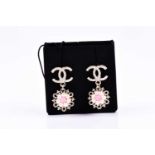 Chanel. A pair of costume earrings, double C logo, suspended with a floral cluster, in original