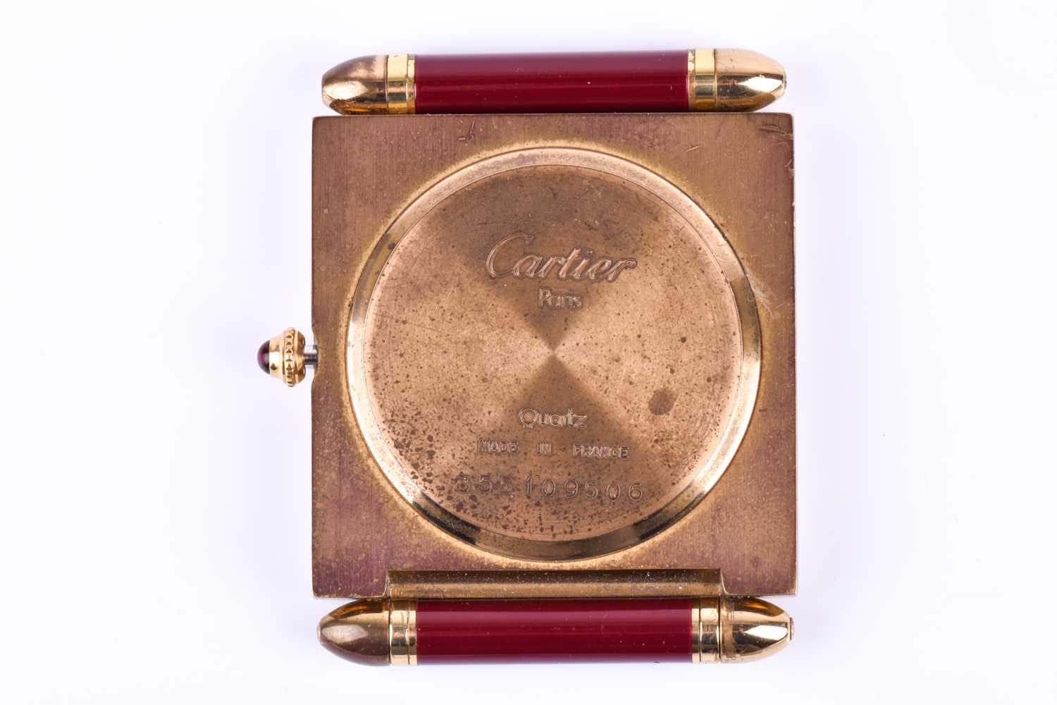 A Cartier travel clock, of square form with gilt metal case with claret lacquered Roman numerals, - Image 12 of 13