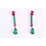 An unusual pair of emerald and ruby earrings, each with a collet-set mixed oval-cut ruby, above a