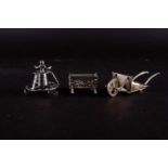 Three miniature Continental silver novelty items, comprising a barrow, cradle and child's walker,