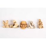 Five Japanese ivory netsukes, late 19th/early 20th century, to include a performer wearing a mask, a