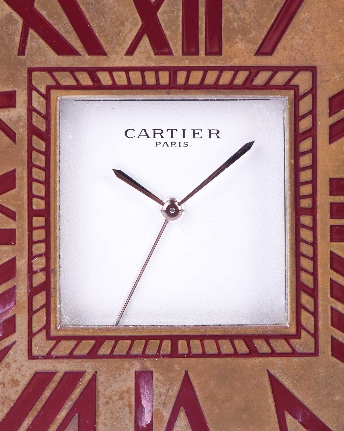 A Cartier travel clock, of square form with gilt metal case with claret lacquered Roman numerals, - Image 10 of 13