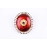 A yellow metal, red enamel, and pearl brooch, of oval form, the raised central segment inset with