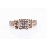 A yellow metal and diamond ring, pave-set with small round brilliant-cut diamonds in a squared