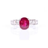 An impressive diamond and ruby ring, the diamond band inset with old-cut diamonds of approximately