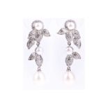 A pair of silver, pearl, and cubic zirconia drop earrings, the mounts of foliate design pave-set