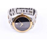 A Movado stainless steel and gold plated wristwatch, the black dial with gilt roundel at 12 o'clock,