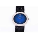 A Rolex Cellini 18ct white gold and diamond dress wristwatch the oval blue minimalist dial with slim