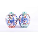 A near pair of Kangxi period porcelain caddies, early 18th century, European decorated, the