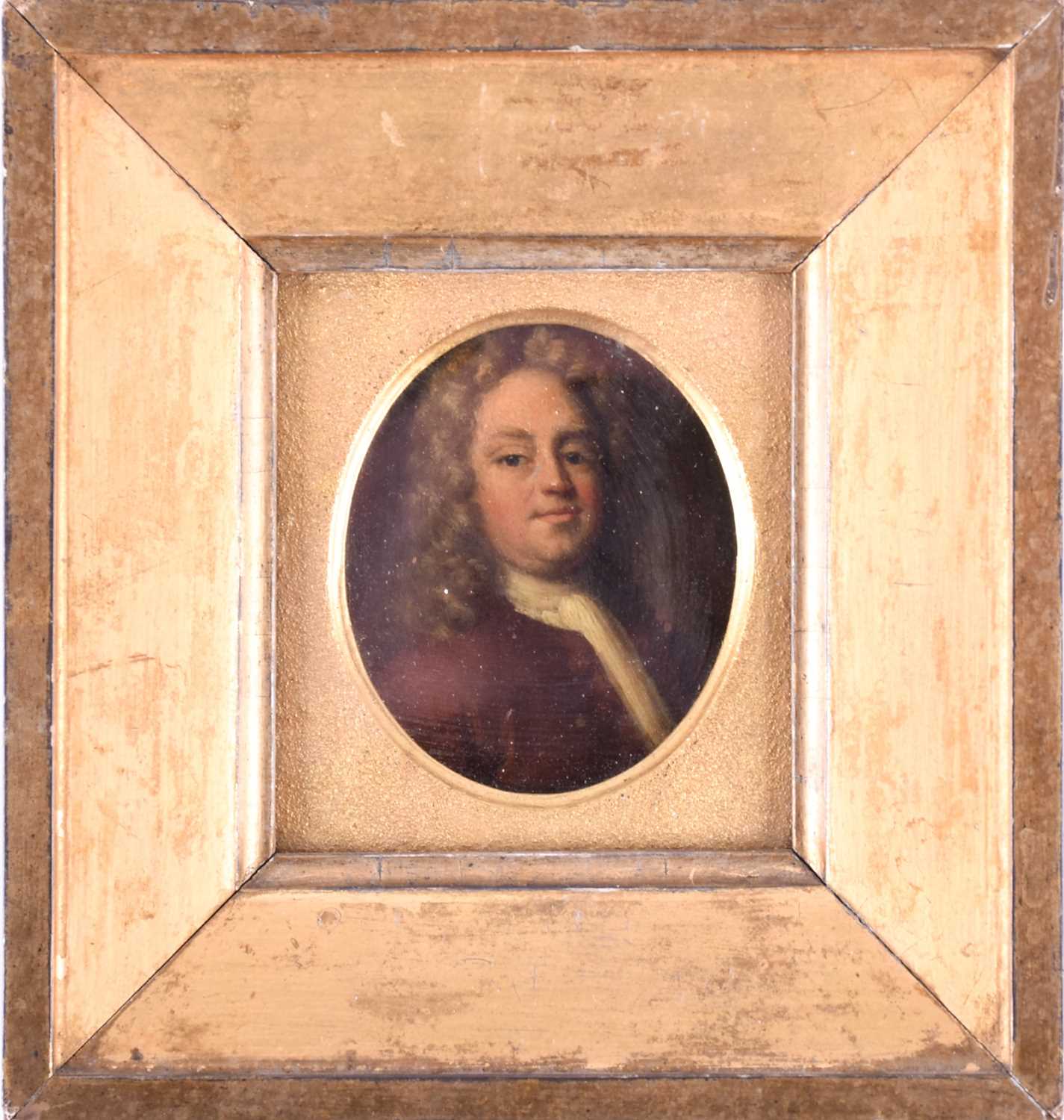 An 18th century oval portrait miniature of a gentleman, bust length, oil on copper, 7 cm x 5.6 cm,