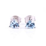 A pair of 9ct white gold and aquamarine ear studs, each set with a trillion-cut aquamarine, each 5 x