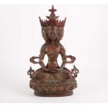 A parcel gilt bronze figure of Ushnishavijaya Namgyalma, seated holding a dharmachakra, on lotus