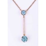 An early to mid 20th century yellow metal and blue zircon pendant, set with a mixed round-cut