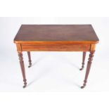 A Regency mahogany foldover tea table, with plain folding top, supported on reeded tapering legs