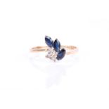 A 9ct yellow gold, diamond, and sapphire ring, set with three marquise-cut dark blue sapphires,