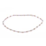 An 18ct white and yellow gold and diamond necklet, of curved flat design, formed of bar-link grain-