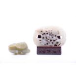 A Chinese Jade carving, late Qing, carved as two opposing chilong amongst rui shape fronds, on