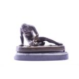 A small bronze figure 'The Dying Gaul', 19th century, on a polished black slate oval base, the