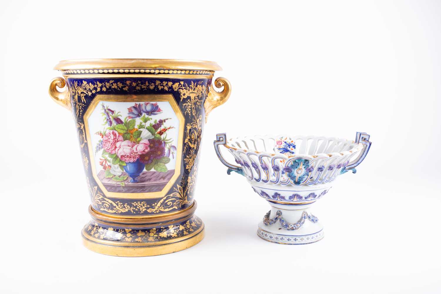 A 19th century porcelain blue and gilt vase, possibley Derby, with painted panels flowers and a