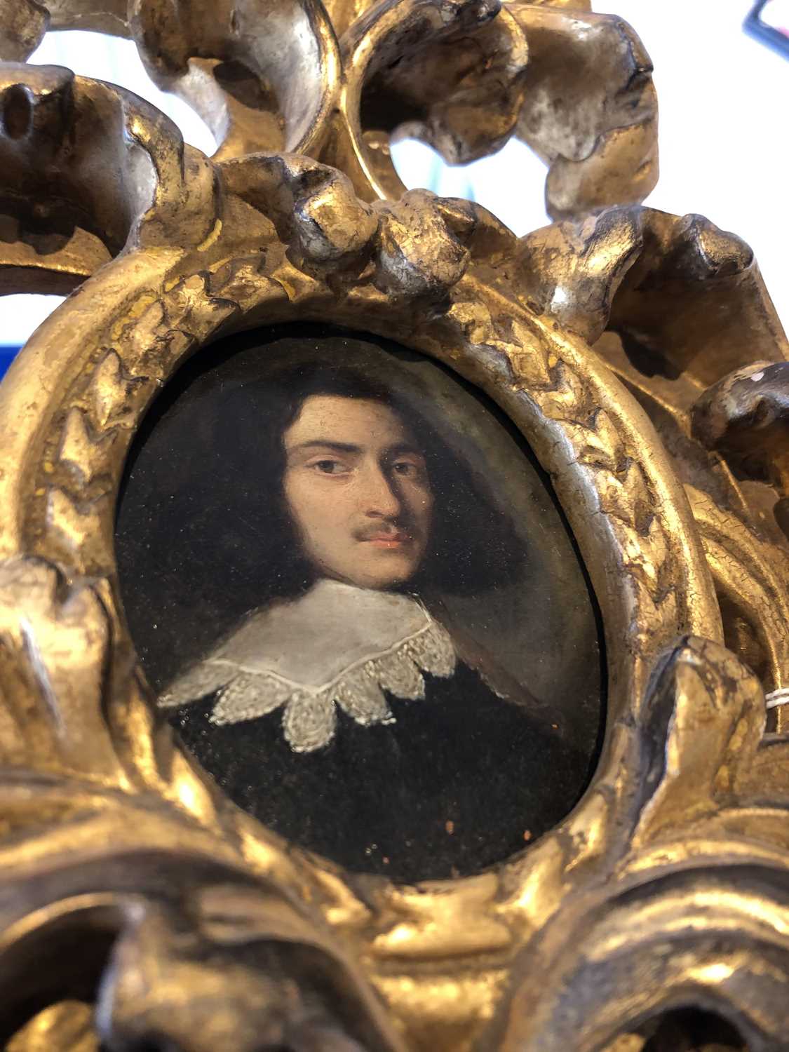 A 17th century oval portrait miniature of a gentleman, bust length wearing a white lace collar, - Image 12 of 12