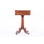 A Regency mahogany work table, the well figured top with a running inlaid ebony border of foliate