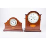 An Edwardian mahogany mantel clock, the white enamel dial with black Roman numerals, 26 cm high,