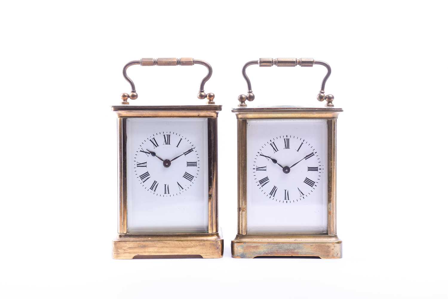 Two late 19th century French gilt brass four-glass carriage clocks, each with white enamel dial,