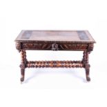 A Victorian carved oak library table, the partially leather inset top, with carved border over two