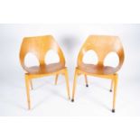 Carl Jacobs for Kandya, two Jason Chairs, 1950s, laminate wood and beech, with shaped wooden one