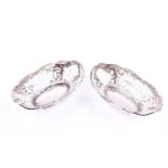 A pair of silver bon bon fishes, of oval form with pierced decoration, hallmarked Birmingham 1911,