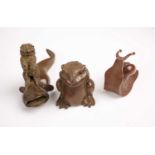 Three Japanese novelty bronze figures, late 20th century, comprising a cat astride a cat fish, Gamma