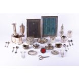 A mixed group of silver items to include a tankard, sifters, cruets, a filled candlestick and