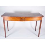 A George III mahogany bow-front serving table, the plain top over a square inset frieze and