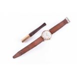 An Avia 9ct yellow gold wristwatch, the silver dial with baton numerals on a brown leather strap,