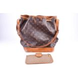 A Louis Vuitton bucket handbag with monogrammed textured leather, drawstring fasten, and