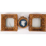 A pair of 19th century giltwood picture frames, the corners with relief moulded shells, with