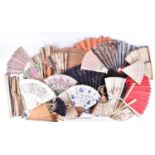 A collection of ladies fans, to include two 19th century examples with carved ivory guards and