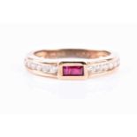 An 18ct yellow gold, diamond, and ruby ring, bezel-set with a rectangular-cut ruby, the shoulders