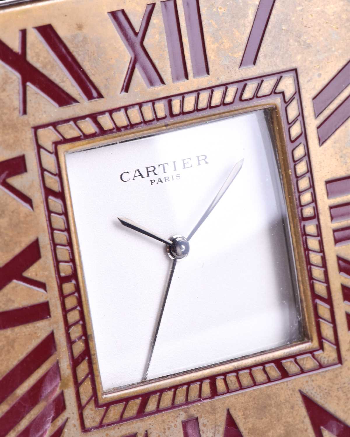 A Cartier travel clock, of square form with gilt metal case with claret lacquered Roman numerals, - Image 5 of 13