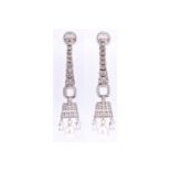 A pair of silver, cubic zirconia, and pearl drop earrings, in the Art Deco style, the elongated