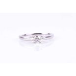 A 14ct white gold and diamond solitaire ring, set with a round brilliant-cut diamond of