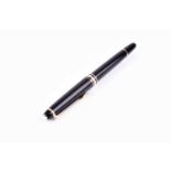 A Montblanc Meisterstuck ball point pen, with black resin cap and body, and gold plated mounts.