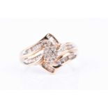 A yellow metal and diamond ring, the crossover mount centred with a marquise-shaped cluster, the
