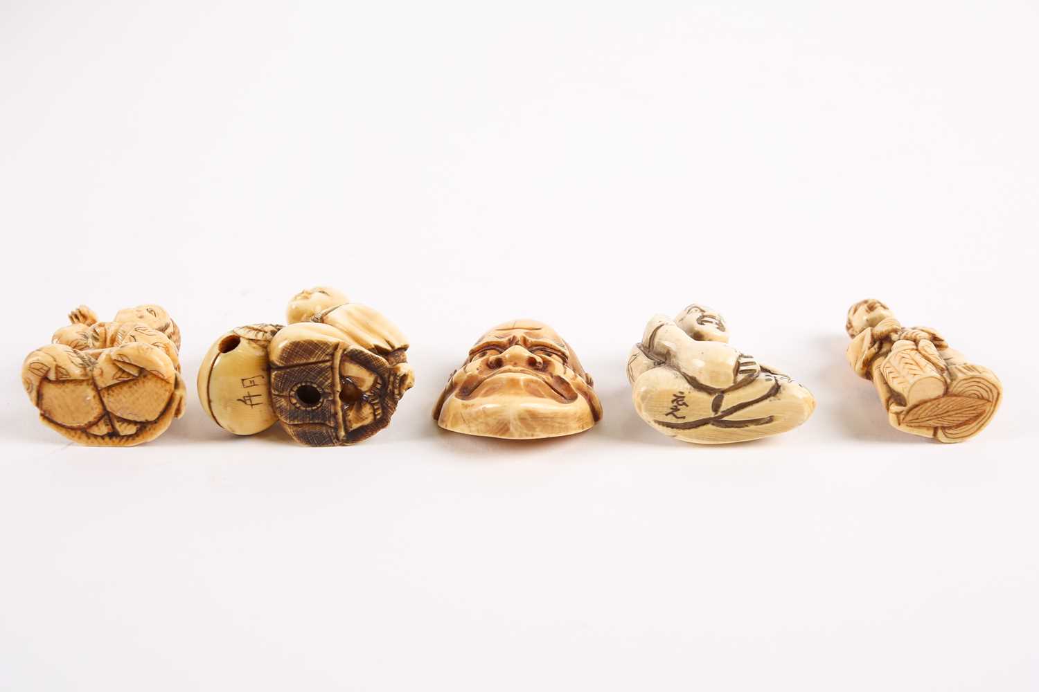 Five Japanese ivory netsukes, late 19th/early 20th century, to include a performer wearing a mask, a - Image 2 of 3