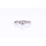 A platinum and solitaire diamond engagement ring, set with a round brilliant-cut diamond of