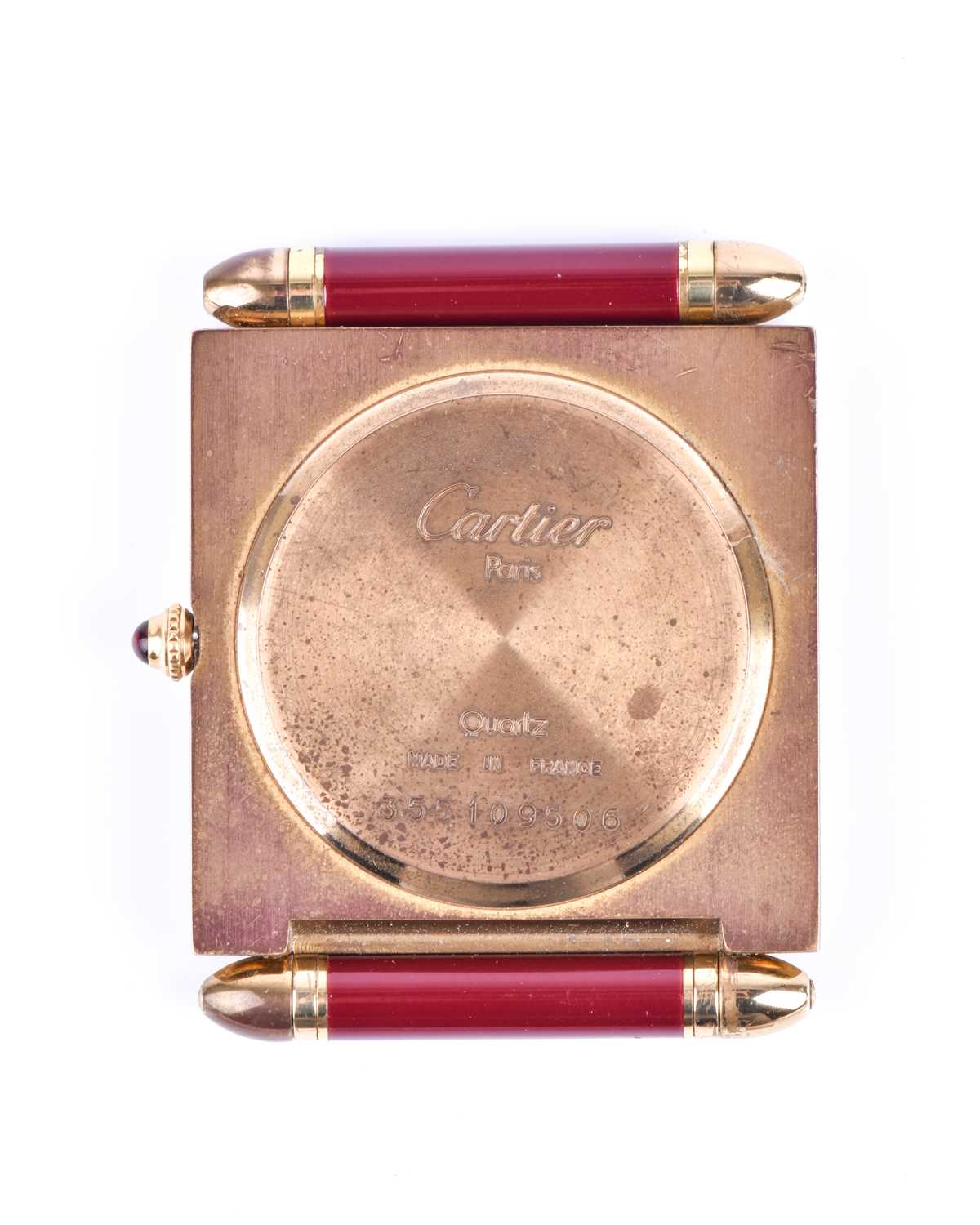 A Cartier travel clock, of square form with gilt metal case with claret lacquered Roman numerals, - Image 6 of 13