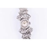Omega. A white metal and diamond ladies cocktail watch, the round face with baton dial and diamond-
