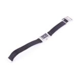 A ladies DKNY stainless steel wristwatch, with rectangular black dial, numbered 12 to top of dial,